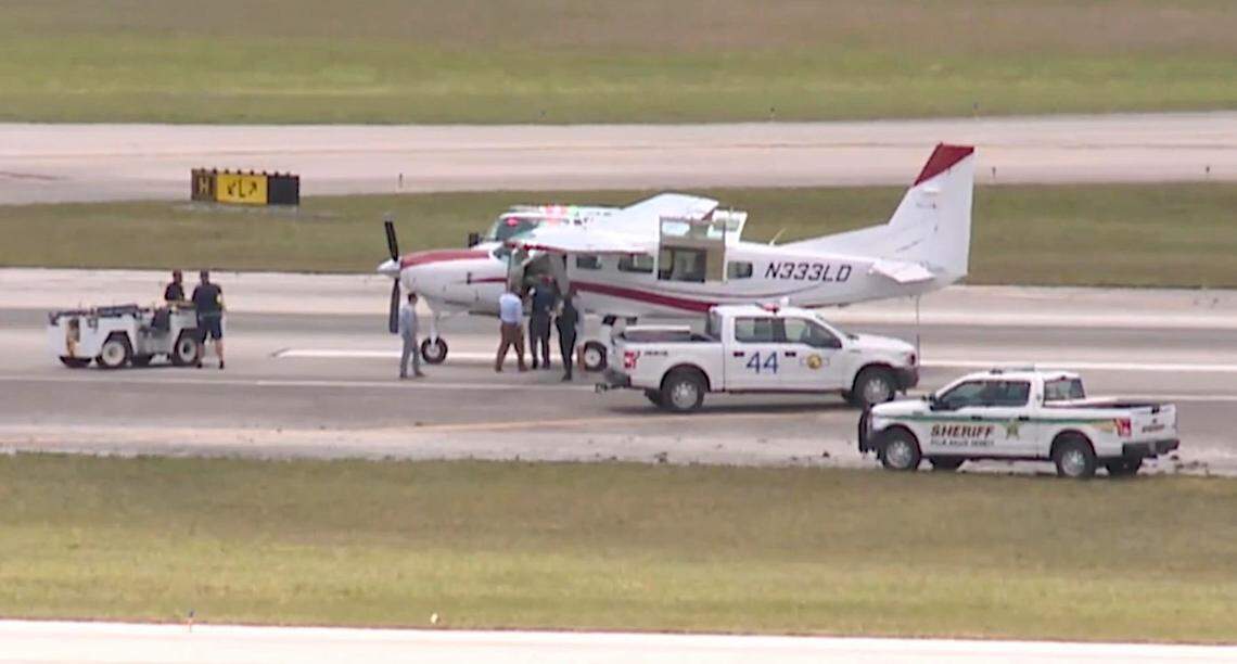 Darren Harrison arrives safely on the ground at Palm Beach International Airport. WPTV via AP