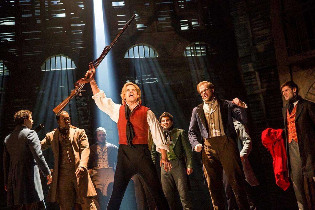 Les Miserables is starting Tuesday at the Broward Center. At left, with back facing camera, is local star Joshua Grosso, who plays Marius.