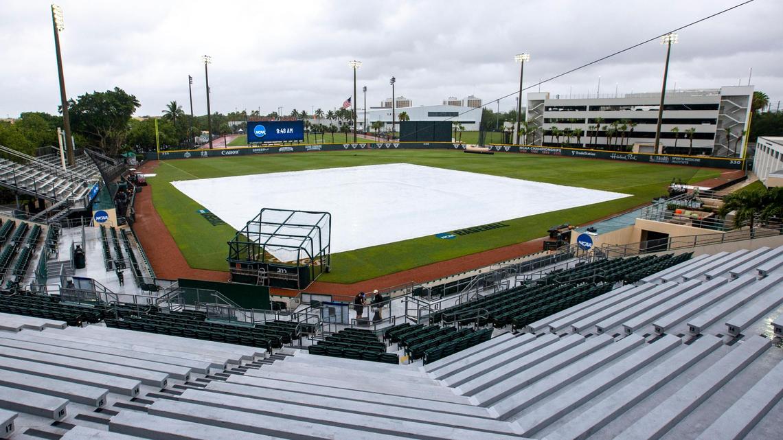 A tarp covers the infield as the University of Miami baseball team was forced to postpone the first round of the NCAA Division I Baseball Tournament against Canisius College due to rain at Alex Rodriguez Park at Mark Light Field in Coral Gables, Florida, on Friday, June 3, 2022. The Coral Gables Regional has been moved to Saturday, June 4th.