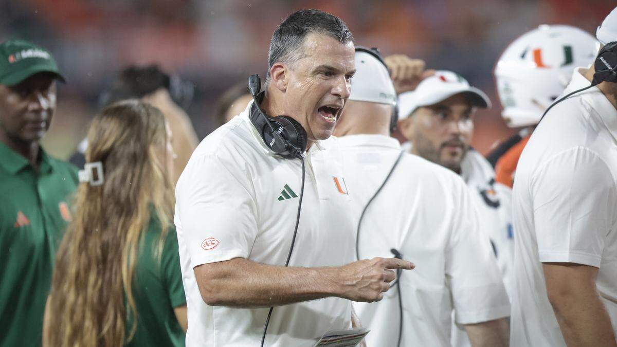 Miami Hurricanes head coach Mario Cristobal reacts from the sidelines in the first half during an NCAA football game against the Notre Dame Fighting Irish at Hard Rock Stadium in Miami Gardens, Florida, on Sunday, August 31, 2025. 