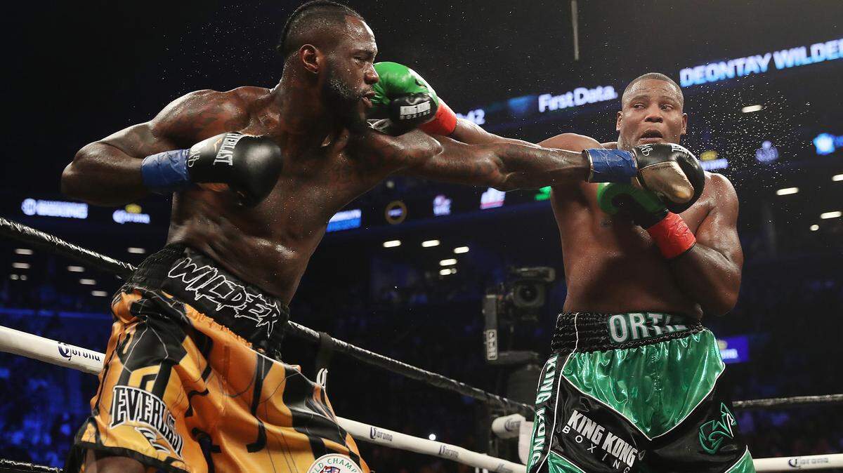 Deontay Wilder exchanges punches with Luis Ortiz during their WBC Heavyweight Championship fight at Barclays Center on March 3, 2018 in the Brooklyn Borough of New York City. (Photo by Al Bello/Getty Images)