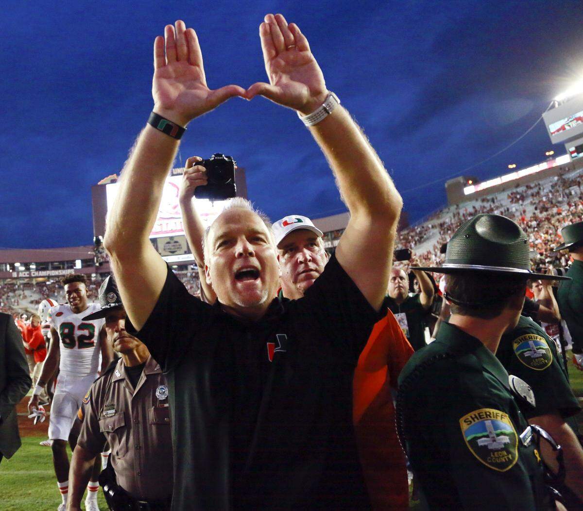 Miami Hurricanes coach Mark Richt celebrates after defeating the FSU Seminoles 24-20 at Doak Campbell Stadium in Tallahassee on Saturday, Oct. 7, 2017.