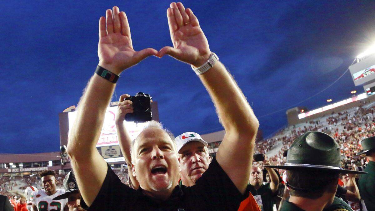 Miami Hurricanes coach Mark Richt celebrates after defeating the FSU Seminoles 24-20 at Doak Campbell Stadium in Tallahassee on Saturday, Oct. 7, 2017.