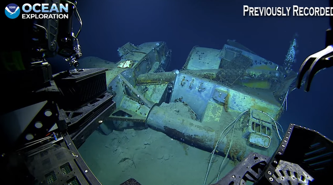 A box springs from a mattress can be seen atop wreckage in the upper right of this photo taken on the USS Nevada. The ship was used for target practice with much of its furnishings still aboard, historians say.