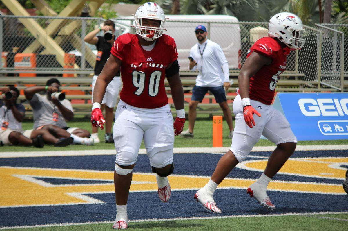 Chaminade defensive lineman Donta Simpson celebrates after returning an interception 30 yards for a touchdown in the Lions’ 35-14 win over St. Frances Academy on Saturday at St. Thomas Aquinas.