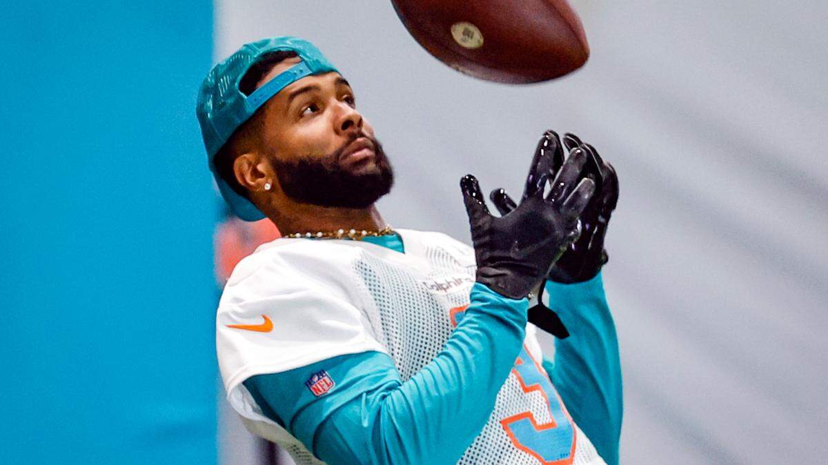 Miami Dolphins wide receiver Odell Beckham Jr. (3) tosses a football during practice at the Baptist Health Training Complex in Miami Gardens, Florida on Wednesday, June 5, 2024.