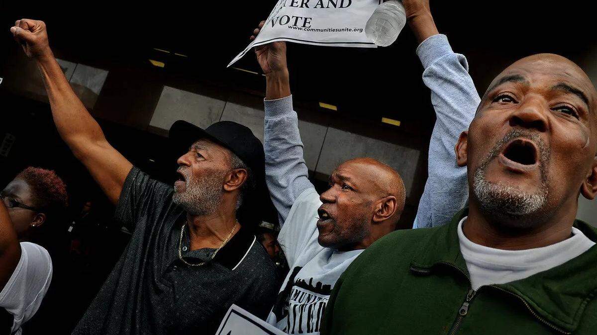 Former prisoners in Florida celebrate having their voting rights restored.