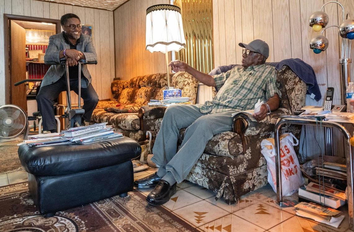 Miami real estate and mortgage broker Danny Felton with his father, Willie Felton, Sr., in the family room of Danny’s childhood home, which his father built in the 1970s and still owns. Part of Danny Felton’s mission as a Realtor is to educate Black residents about the importance of homeownership amid the waves of gentrification affecting Black neighborhoods.