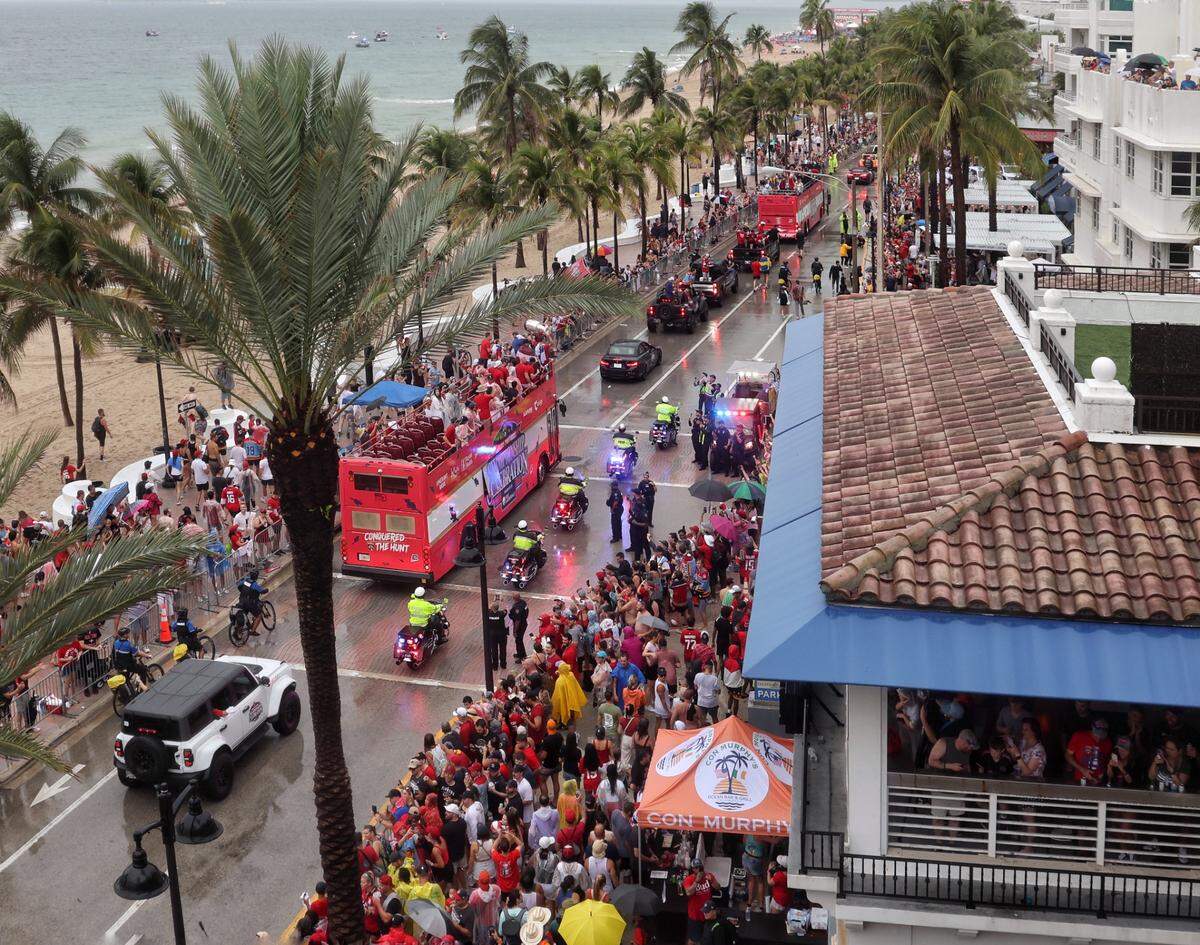The rain didn’t stop the Panther’s championship celebration as hypes the rain-soaked fans as the double-decker makes its way south on A1A after winning the Stanley Cup during the parade in Fort Lauderdale on Sunday, June 30, 2024.