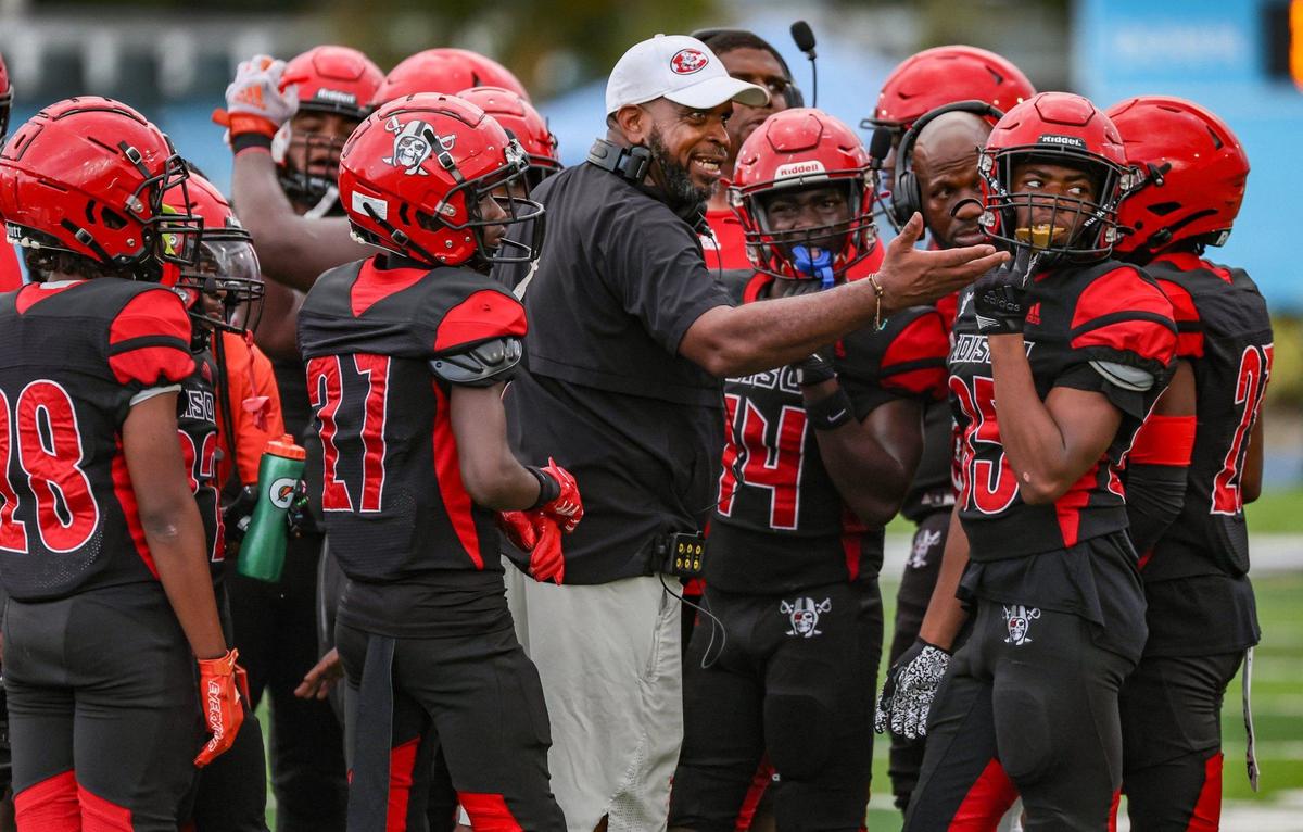 Edison High School coach Luther Campbell speaks with players during the game against Miramar High Traz Powell Stadium in Miami, Florida on Friday, August 16, 2024.