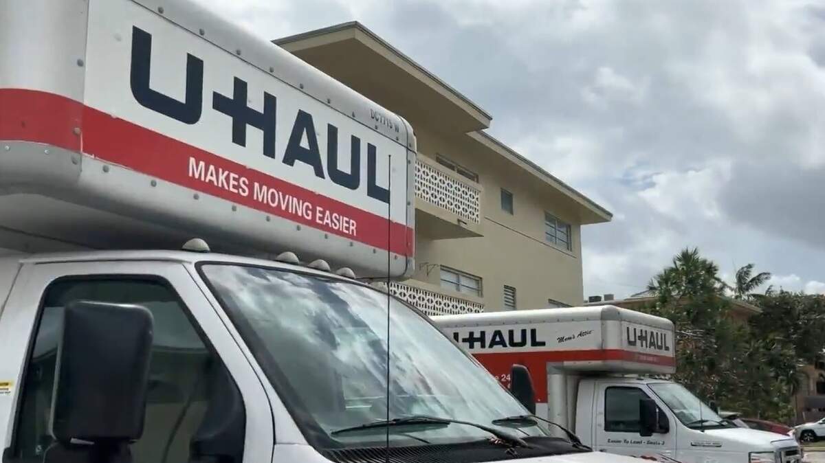 U-Haul trucks were parked outside the building on Northeast 19th Drive in North Miami as residents packed their belongings on March 12, 2026.