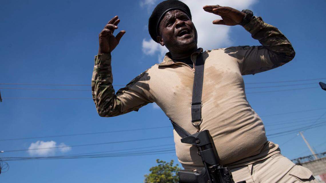 The leader of Haiti’s main armed gang, Jimmy Chérizier, alias Barbecue, speaks to the media during a tour of the La Saline neighborhood, in Port-au-Prince, Haiti, in 2021.