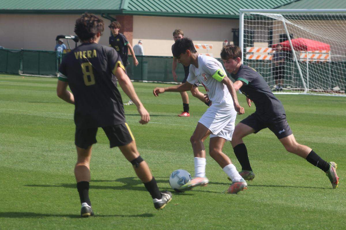 Doral team captain Sebastian Chahin outduels two Viera defenders during Saturday afternoon’s Class 6A state championship game at Spec Martin Stadium in DeLand.