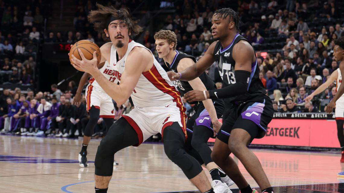 Miami Heat guard Jaime Jaquez Jr. (11) protects the ball from Utah Jazz guard Isaiah Collier (13) during the first quarter at Delta Center.