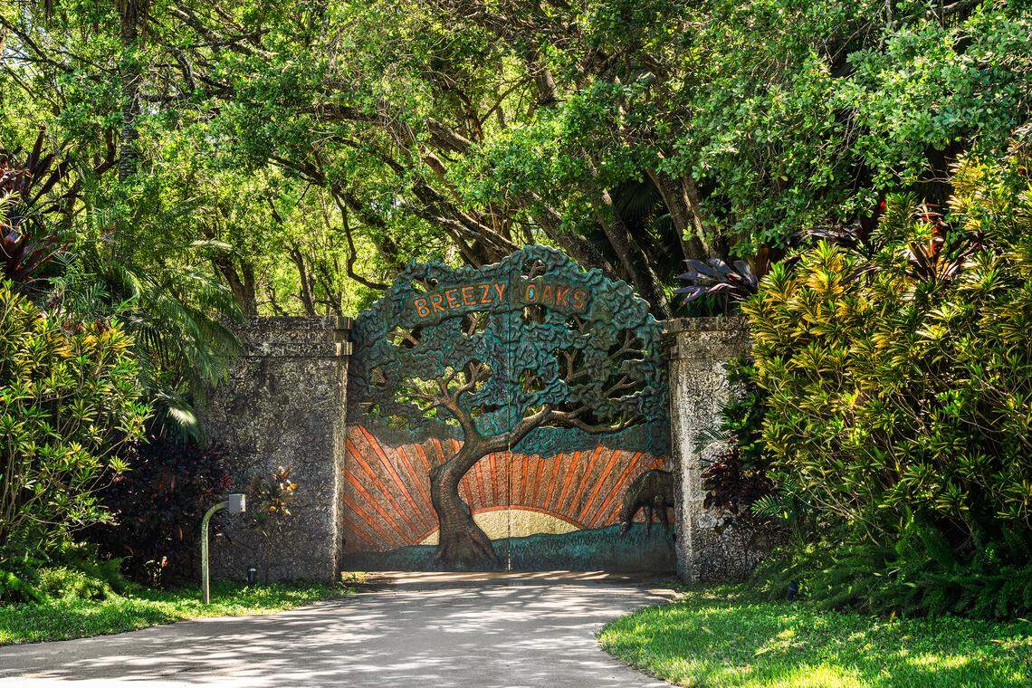 The entrance to the property has a custom copper gate that reads “Breezy Oaks.”