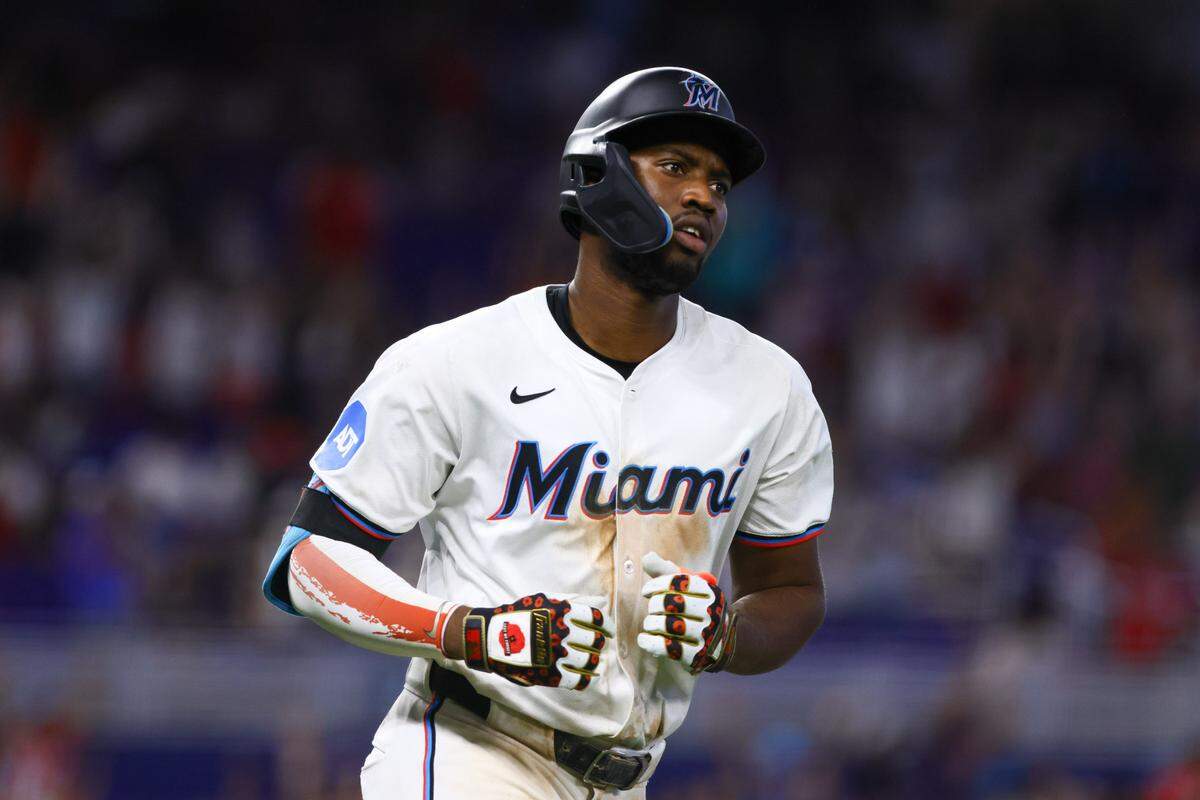 Jul 4, 2024; Miami, Florida, USA; Miami Marlins right fielder Jesus Sanchez (12) circles the bases after hitting a two-run home run against the Boston Red Sox during the eleventh inning at loanDepot Park.