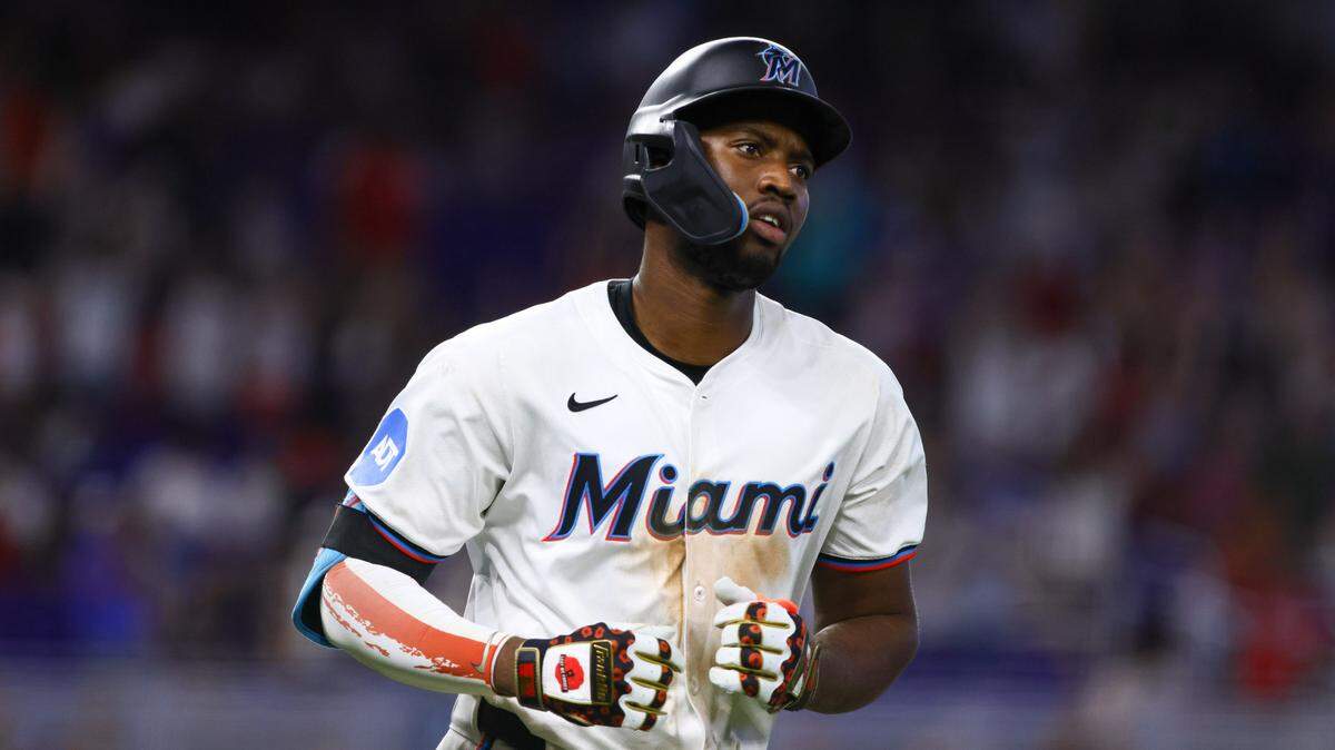 Jul 4, 2024; Miami, Florida, USA; Miami Marlins right fielder Jesus Sanchez (12) circles the bases after hitting a two-run home run against the Boston Red Sox during the eleventh inning at loanDepot Park.