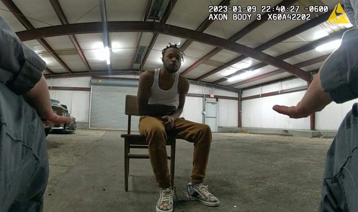 In this image from Baton Rouge Police Department body camera video, officers interact with Jeremy Lee inside a warehouse in Baton Rouge on Jan. 9, 2023. Lee sued the department in August 2023 alleging officers abused him in the police warehouse nicknamed the “Brave Cave.”