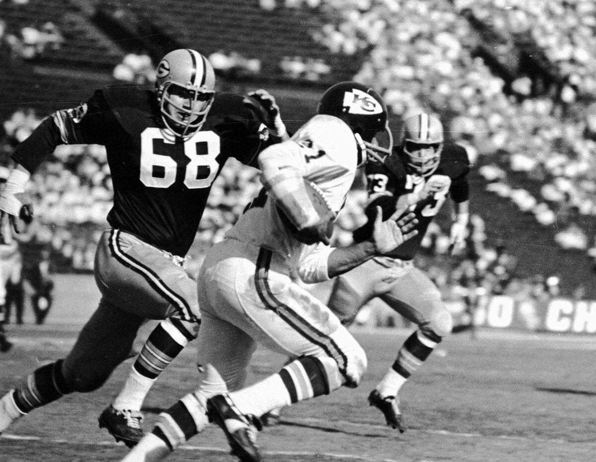 Kansas City Chiefs Mike Garrett (21) on a return as Green Bay’s Gale Gillingham (68) and Jim Weatherwax (73) give chase during the first AFL-NFL World Championship GAme, usually called Super Bowl I, Jan. 15, 1967.
