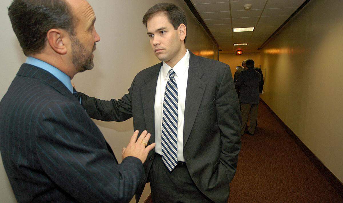Then-state Rep. Marco Rubio speaks with Ron Book in the hallway after the Miami-Dade County Legislative Delegation meeting at the Florida Capitol on Wednesday, March 5, 2003.
