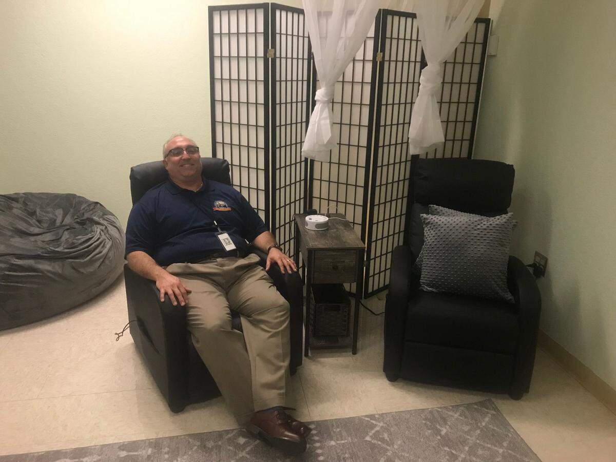The Monroe County School District added “Wellness Rooms” like this one to seven public schools for the 2022-2023 school year. Harry Russell, the district’s executive director of human resources, is pictured here trying out the room.