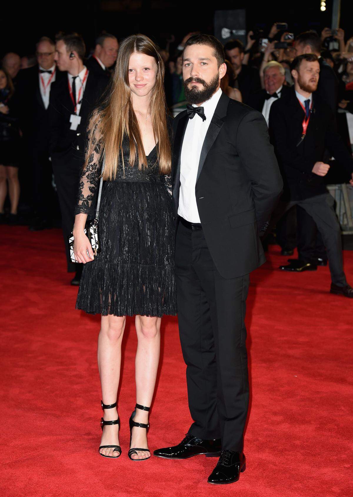 LONDON, ENGLAND - OCTOBER 19: Mia Goth and actor Shia LeBeouf attend the closing night European Premiere gala red carpet arrivals for "Fury" during the 58th BFI London Film Festival at Odeon Leicester Square on October 19, 2014 in London, England. (Photo by Gareth Cattermole/Getty Images for BFI)