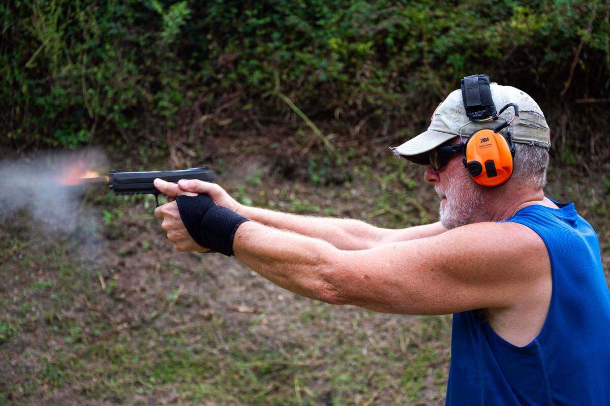 Jeff Meling shoots a 9mm Sig Sauer hand gun at Shoot GTR, located at 1610 NW 65th Pl., in Gainesville, Fla., on Sept. 20, 2023.
