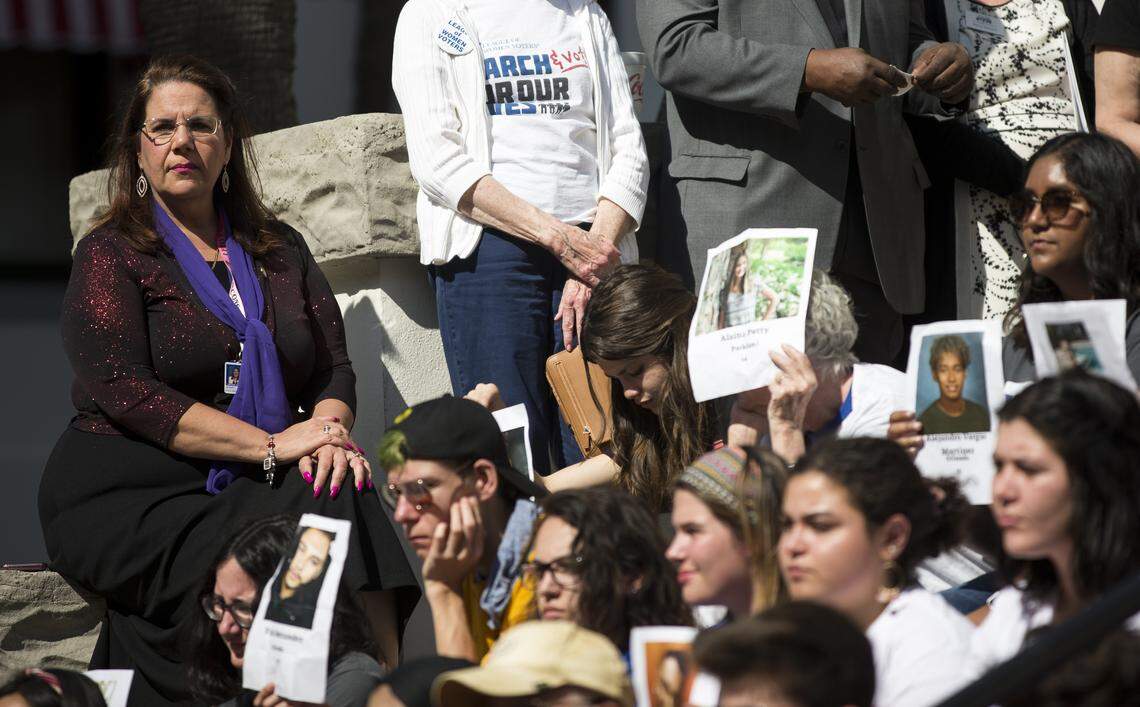 Students and supporters of March for Our Lives carry photos of the victims in last year’s shooting at Marjory Stoneman Douglas High School in Parkland during a rally opposing House Bill 7093 on the steps of Florida’s historic Capitol, April 3, 2019, in Tallahassee, Florida. HB 7093 proposes arming teachers.