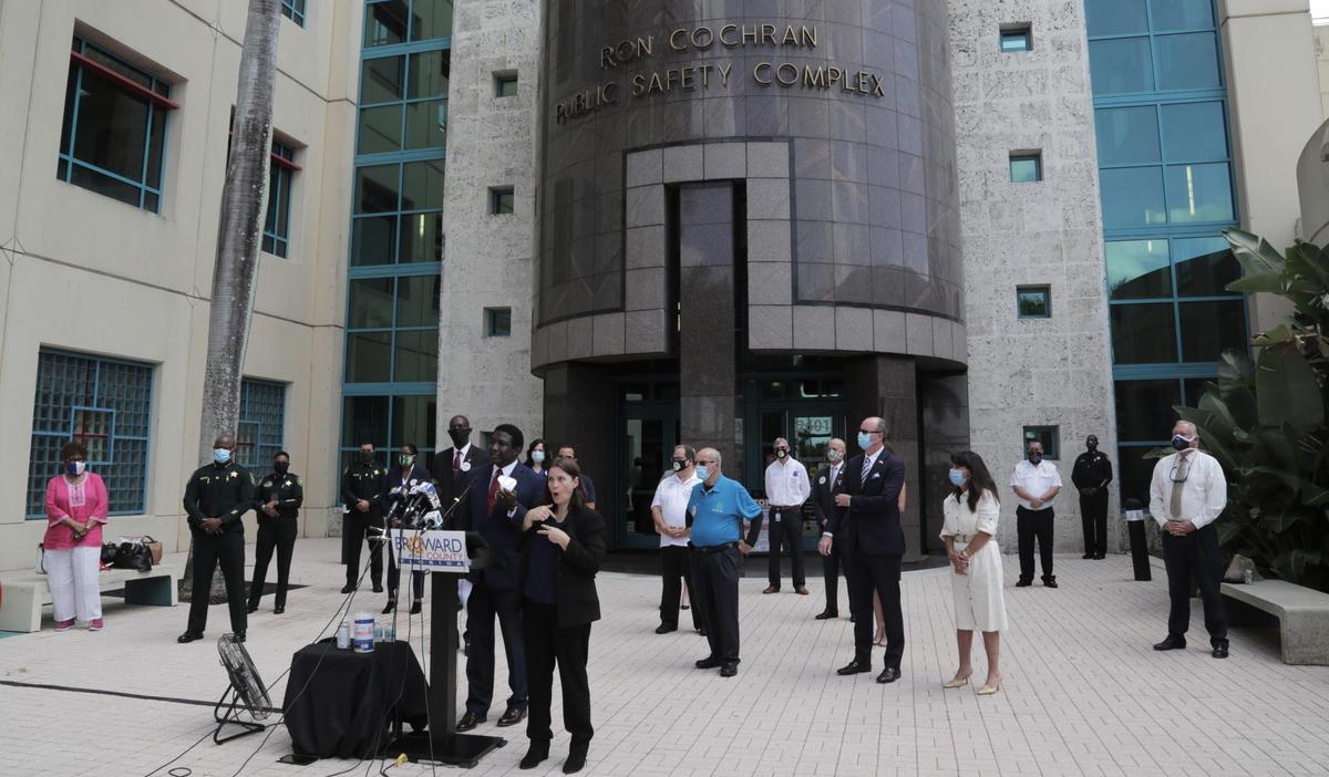 Broward County Mayor Dale Holness speaks at a press conference outside the sheriff’s office in Fort Lauderdale where he was joined by Sheriff Gregory Tony and the mayors of nine cities across the county. Broward County issued a new emergency order Wednesday that will force businesses to temporarily shut down if they’re found violating laws related to social distancing and facial coverings.
