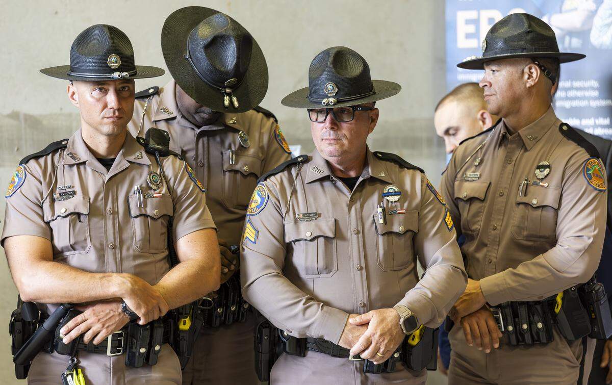 Florida Highway Patrol officers attend a press conference with U.S. Immigration and Customs Enforcement Deputy Director Madison Sheahan to discuss Operation Criminal Return at the South Florida office of U.S. Immigration and Customs Enforcement and Enforcement and Removal Operations on Thursday, Nov. 13, 2025, in Miramar, Fla.