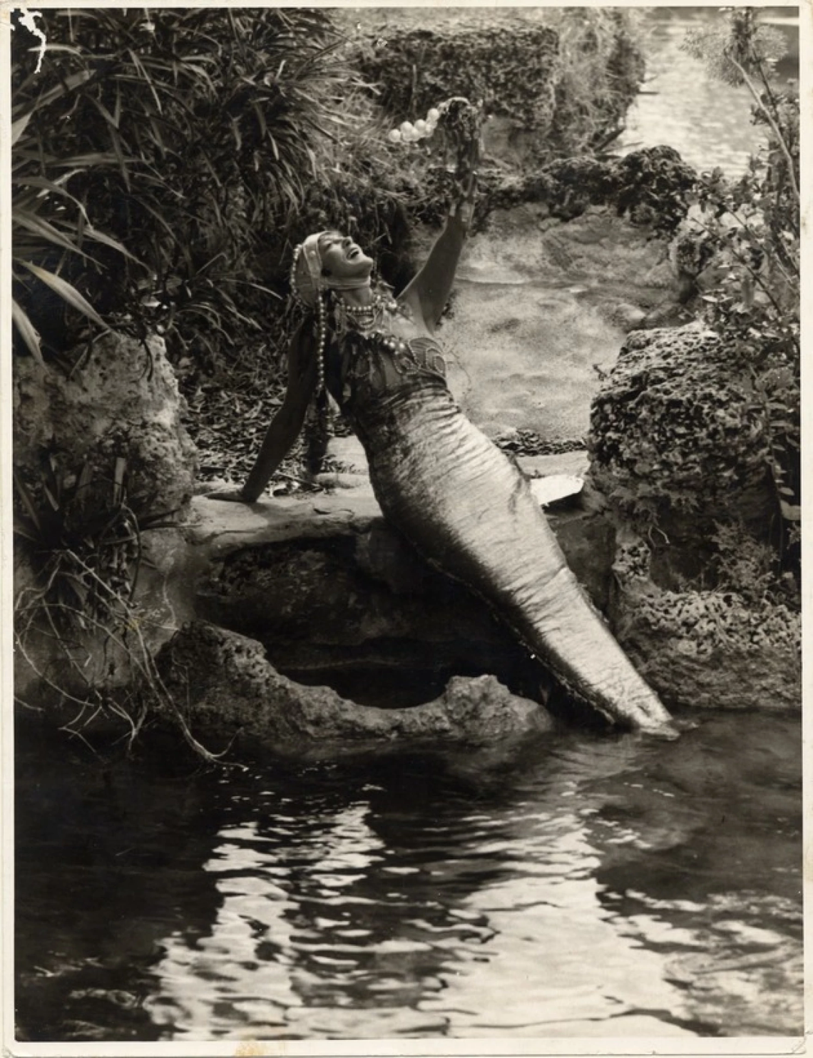 Annette Kellerman, a professional swimmer, dressed as a mermaid at the Venetian Pool, photographed in 1925.