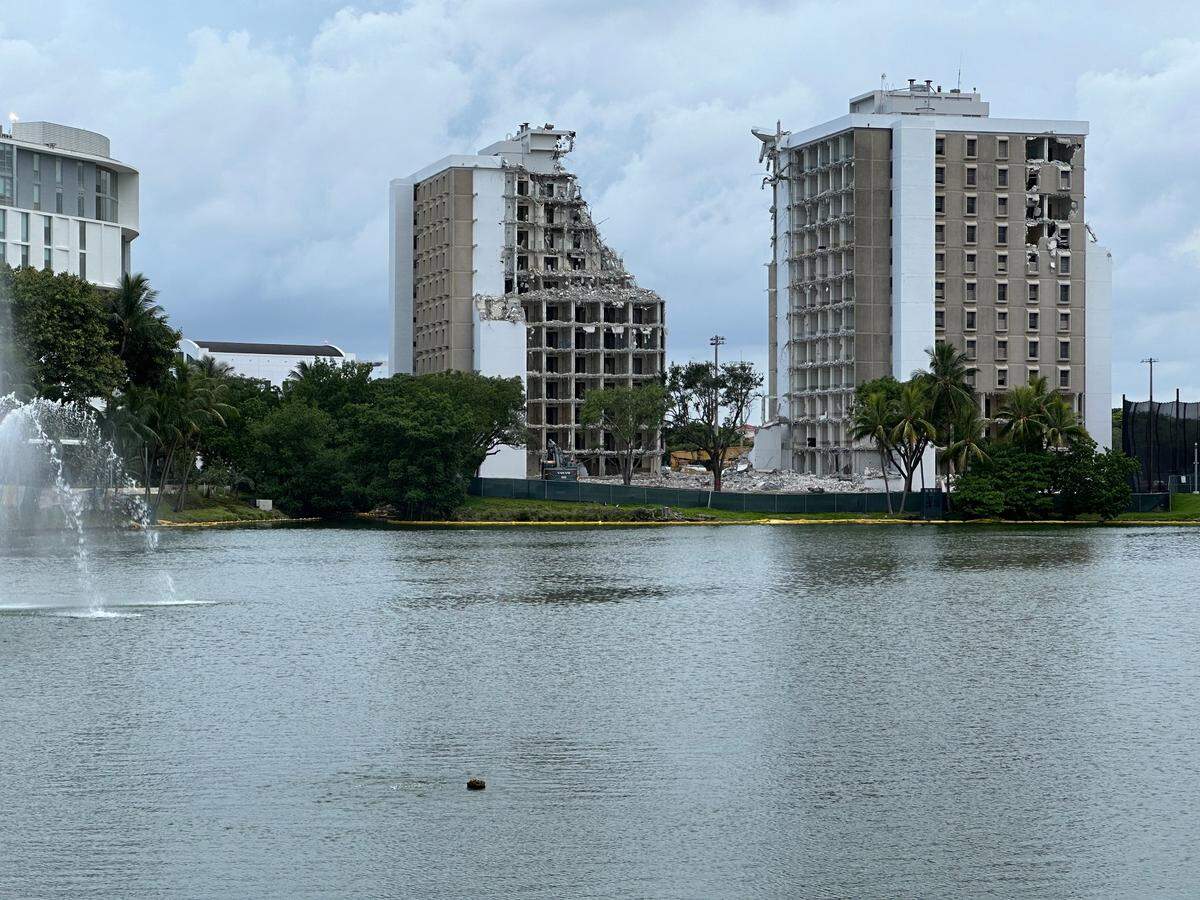 Two University of Miami dorm towers, pillars around the campus’ Lake Osceola since the 1960s, are being demolished on July 23, 2024, as part of the school’s Centennial Village plan to build more housing for students.