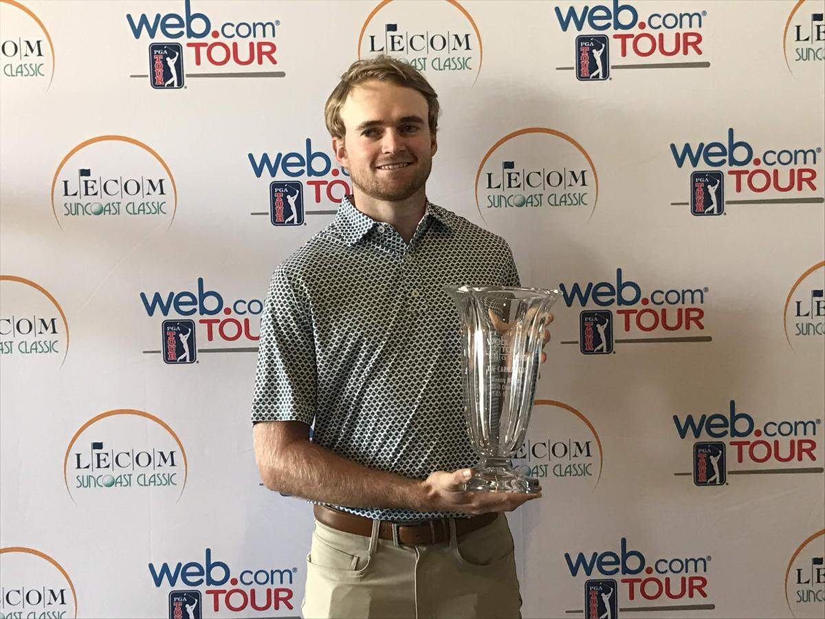 Danny Walker, who starred at Lakewood Ranch High and the University of Virginia, holds the trophy he won in December at the Web.com Tour’s Qualifying School final stage. Walker earned his 2019 Web.com Tour card and is playing this week’s LECOM Suncoast Classic, scheduled for Thursday, Feb. 14 through Sunday, Feb. 17.