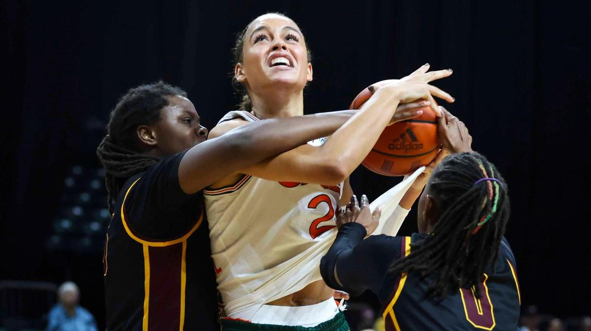 Miami Hurricanes Natalija Marshall(21) battles Bethune-Cookman’s Kayla Clark (25), a Miami Central High grad, during the third quarter of a game on Sunday, Dec. 8, 2024, at Watsco Center in Coral Gables, Fla.