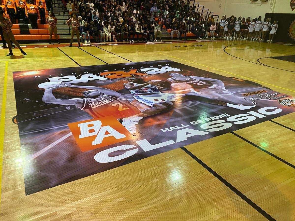 The banner on the court at Boyd Anderson High during a ceremony on Dec. 13, 2024 commemorating the “Mitch Richmond Classic” basketball game between Boyd Anderson and Miami Northwestern.