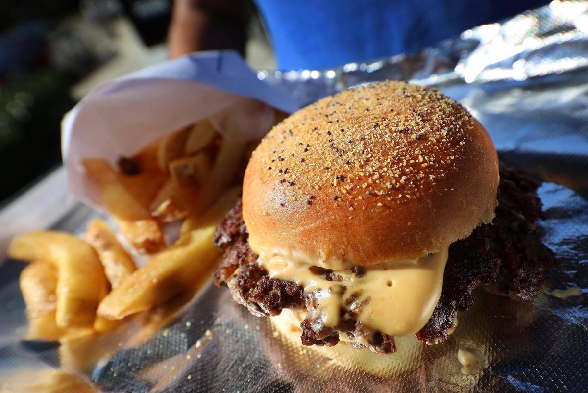 USBS burgers are presented simply, but they have been carefully thought out over the years to use a special blend of beef, ground in house, topped with their own cheese sauce and even poppy-seed buns they bake themselves. This unassuming little burger is easily one of the best in the city. Keily Vasquez and Mike Mayta run the USBS (United States Burger Service) at The Citadel food hall where they run a food kiosk on Wednesday, December 9th, 2020 in Miami’s Little Haiti neighborhood.