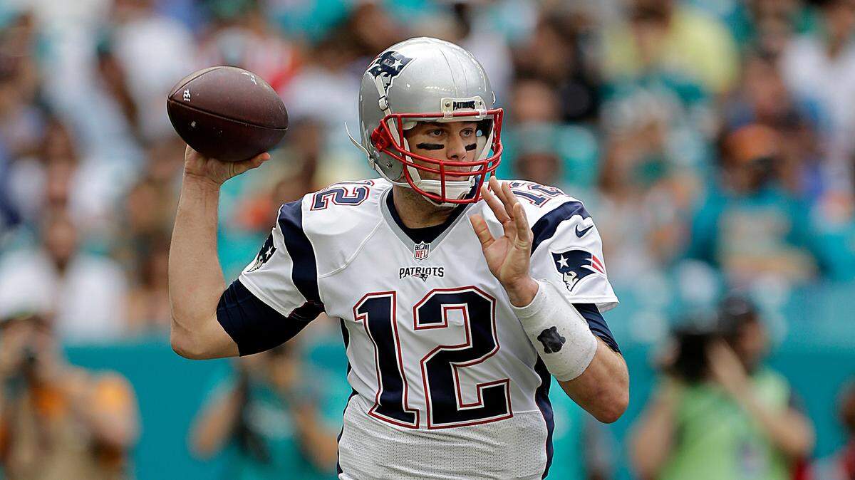 A man is suing the Patriots Hall of Fame and says the museum damaged his flag autographed by Tom Brady. The lawsuit demands a jury trial.