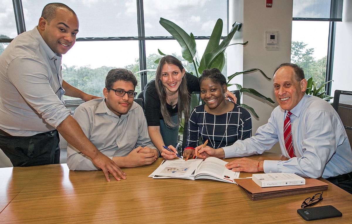 Miami accounting firm Gerson Preston has hired two interns from the Miami Summer Jobs Connect program for low-income youths. From left, Ivan Lopez of Gerson Preston's IT department, intern Andres Arcia, Gerson Preston accountant Carrie Baron, intern Hilairee Lubin and accountant Stuart Rohatiner, who is a firm partner.