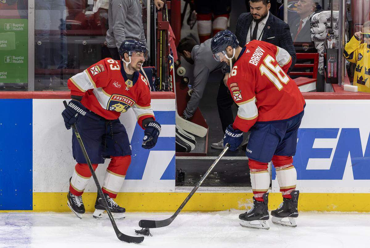 Florida Panthers centers Brad Marchand (63) and Aleksander Barkov (16) celebrate a 6–2 victory over the Carolina Hurricanes in Game 3 of the Eastern Conference Final at Amerant Bank Arena on Saturday, May 24, 2025, in Sunrise, Fla.