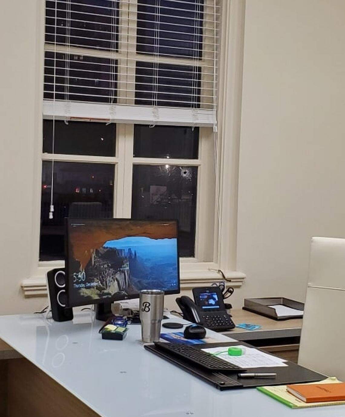 A bullet hole punctured the office window of Coral Gables city clerk Billy Urquia on Thursday, Dec. 5, 2019, in the midst of an attempted armed robbery of a jewelry store across the street.