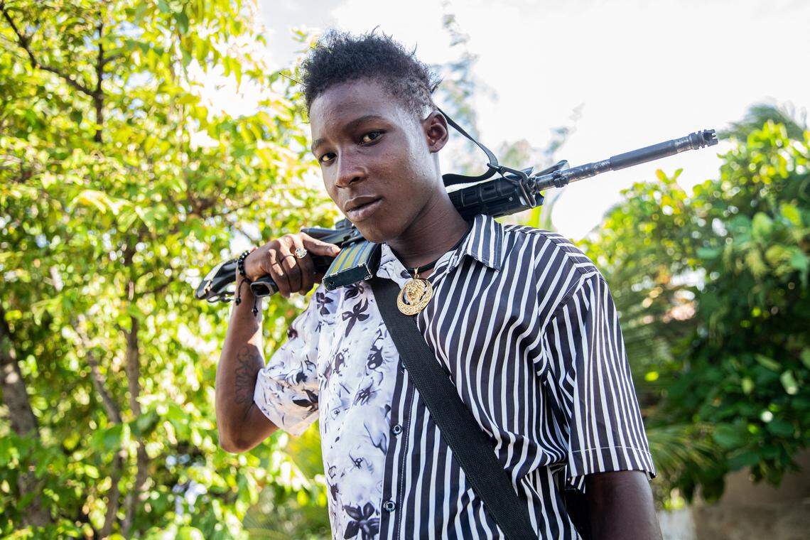 A 14-year-old armed gang member patrols the streets in the Mariani neighborhood of Port-au-Prince, Haiti, on October 6, 2025. Mariani is near the Route Nationale 2, parts of which have been taken over by gangs. More than 16,000 people have been killed in armed violence in Haiti since the start of 2022, the United Nations said on October 2, warning that "the worst may be yet to come". The poorest country in the Americas, Haiti has long suffered at the hands of violent criminal gangs that commit murders, rapes, looting, and kidnappings against a backdrop of chronic political instability. (Photo by Clarens SIFFROY / AFP) (Photo by CLARENS SIFFROY/AFP via Getty Images)