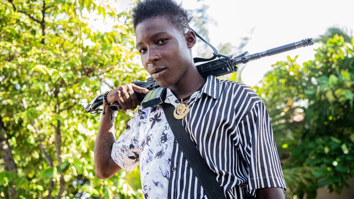 A 14-year-old armed gang member patrols the streets in the Mariani neighborhood of Port-au-Prince, Haiti, on October 6, 2025. Mariani is near the Route Nationale 2, parts of which have been taken over by gangs. More than 16,000 people have been killed in armed violence in Haiti since the start of 2022, the United Nations said on October 2, warning that "the worst may be yet to come". The poorest country in the Americas, Haiti has long suffered at the hands of violent criminal gangs that commit murders, rapes, looting, and kidnappings against a backdrop of chronic political instability. (Photo by Clarens SIFFROY / AFP) (Photo by CLARENS SIFFROY/AFP via Getty Images)