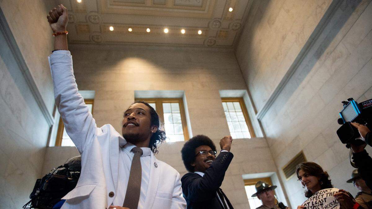 Justin Jones, D-Nashville, and Justin Pearson, D-Memphis, meet with supporters at the Tennessee State Capitol in Nashville, Tenn., on Thursday, April 6, 2023. GOP representatives voted to expel them.