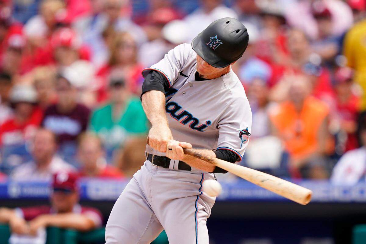 Miami Marlins’ Joey Wendle hits a run-scoring single against Philadelphia Phillies pitcher Kyle Gibson during the second inning of a baseball game, Thursday, Aug. 11, 2022, in Philadelphia. (AP Photo/Matt Slocum)