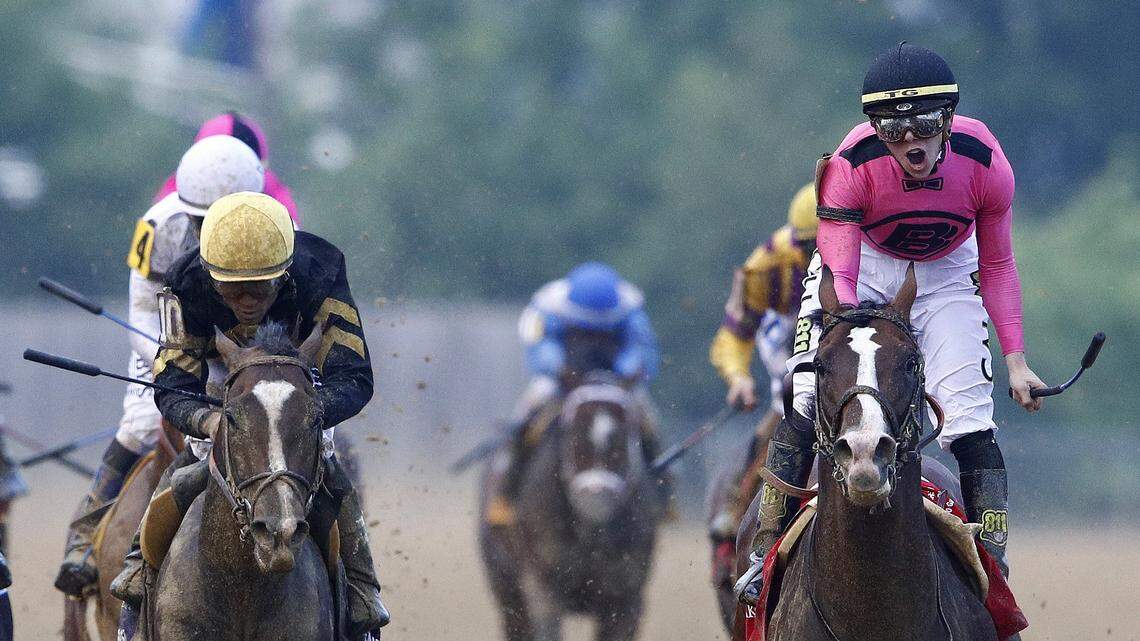 War of Will, ridden by Tyler Gaffalione, right, reacts after crossing the finish line to win the Preakness Stakes horse race at Pimlico Race Course, Saturday, May 18, 2019, in Baltimore.