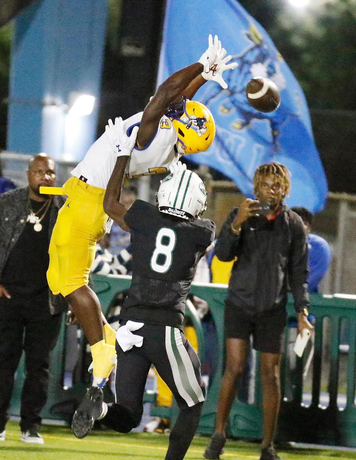Northwestern Bulls running back Jamari Ford attempts to catch a pass during Region 4-2M semifinal playoff football game against Miami Central Rockets on Friday, November 18, 2022 at Traz Powell Stadium in Miami. Andrew Uloza / for Miami Herald