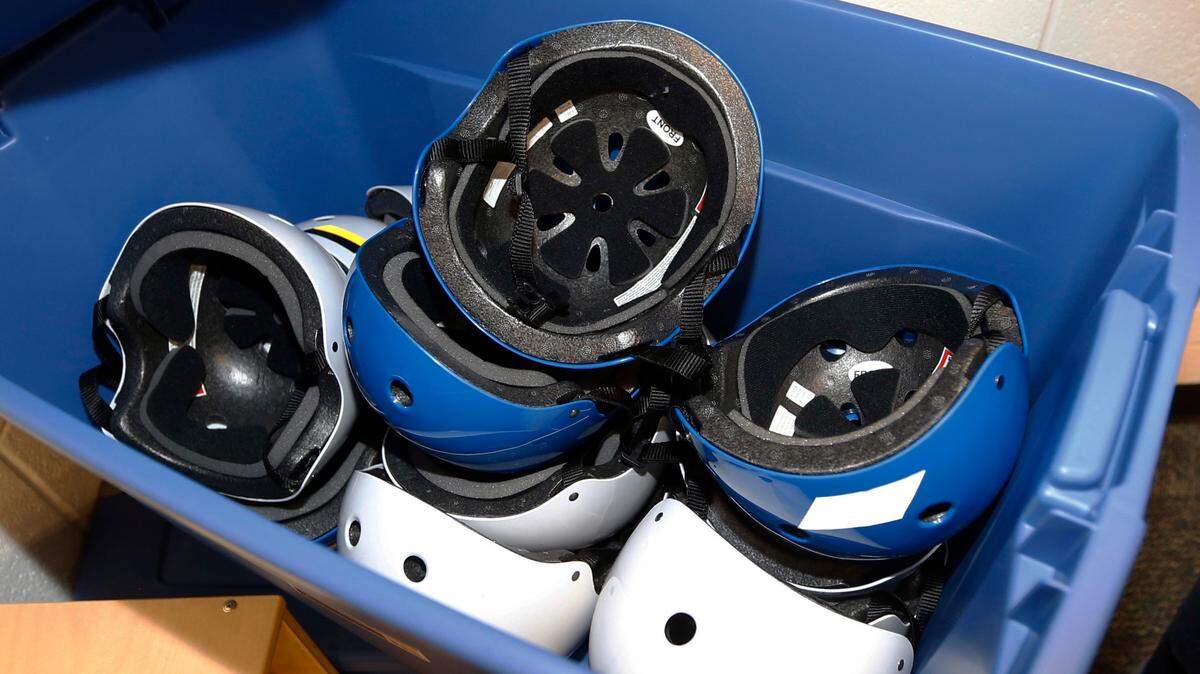Safety helmets in a container in a pre-K classroom at an elementary school in Oklahoma. A third of children develop a mental health problem after a concussion, such as depression and aggression, which could last for years in some kids, a study finds.