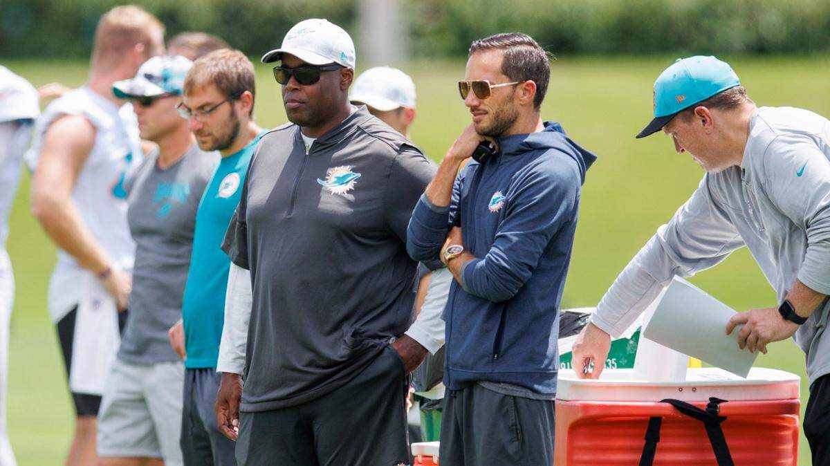 Miami Dolphins head coach Mike McDaniel and Dolphins general manager Chris Grier look from the sidelines during NFL football training camp at Baptist Health Training Complex in Hard Rock Stadium on Thursday, September 1, 2022 in Miami Gardens, Florida.