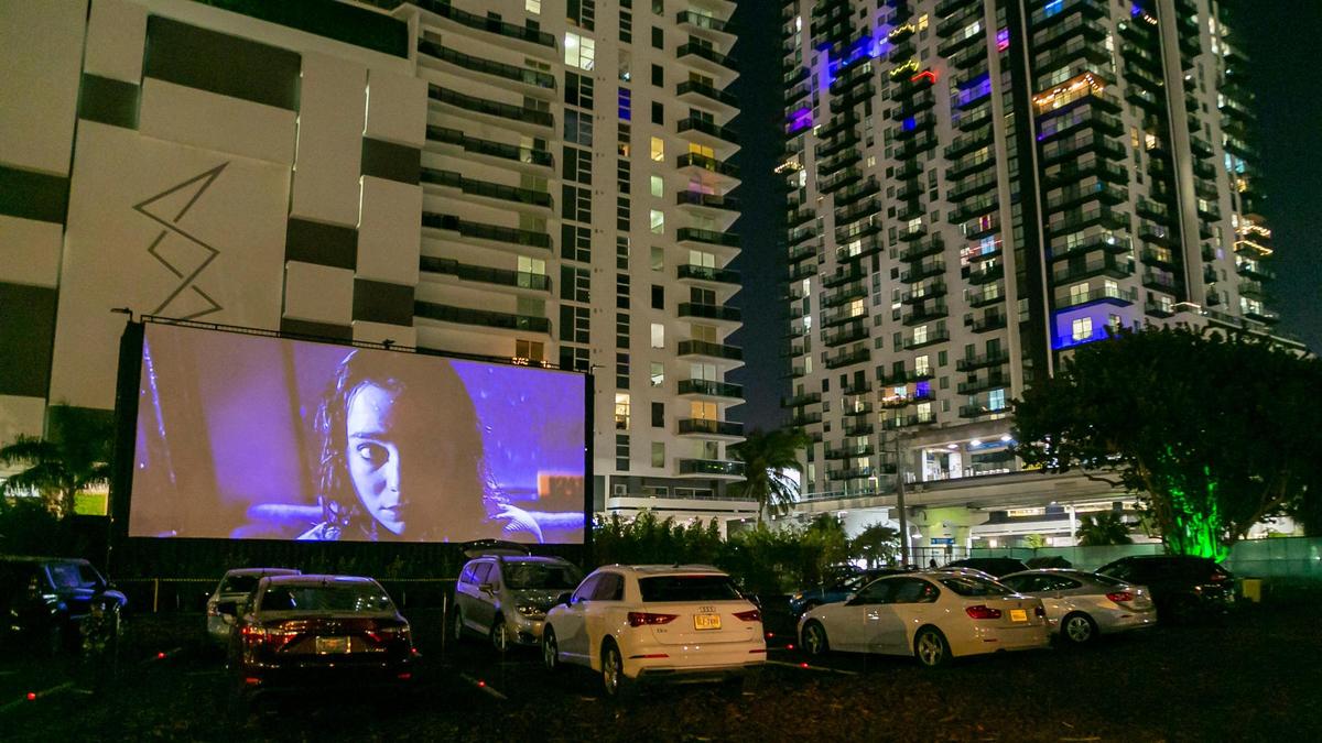 People watch ‘Suspiria’ at the Nite Owl Drive-In theater in downtown Miami, Florida, on Friday, January 22, 2021.