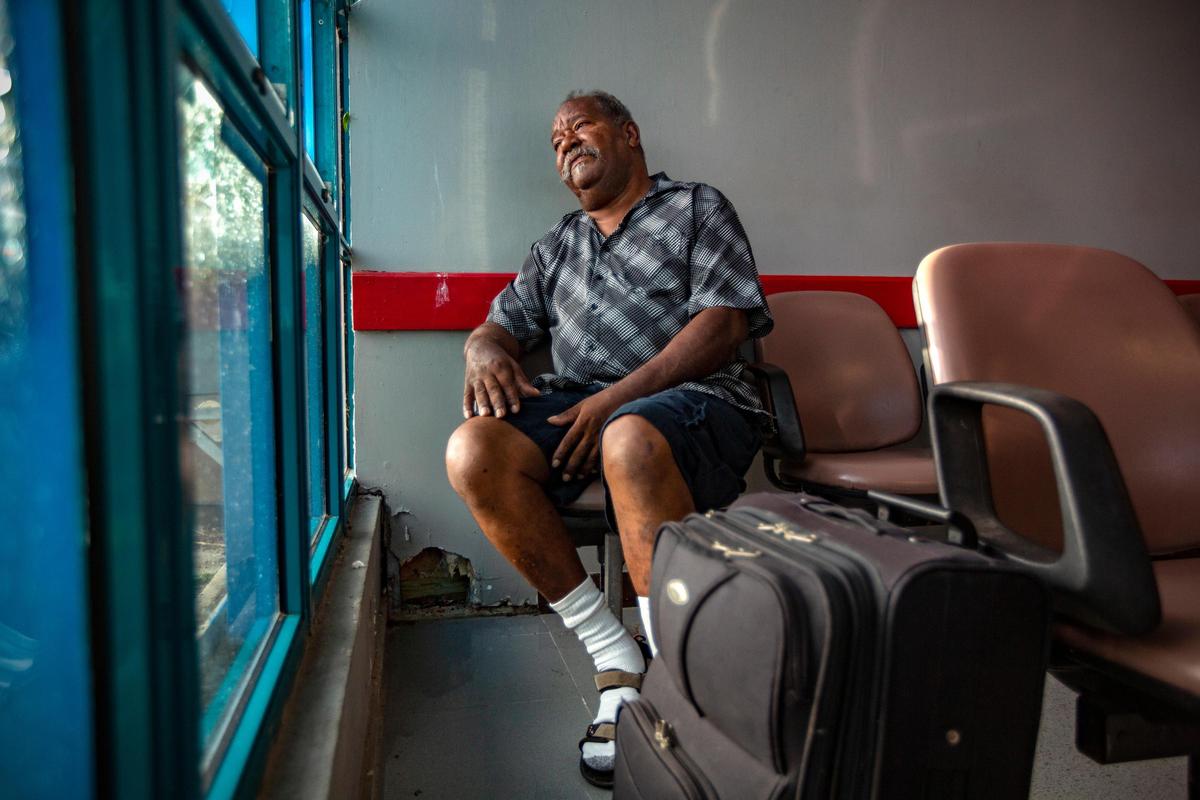 Radamés Cabral, 65, waits at Antonio Rivera Rodríguez Airport, on the island of Vieques, Puerto Rico, for a plane that will take him to Fresenius Kidney Care dialysis center in Humacao on the big island on Aug. 15, 2018. By pickup truck, plane and taxi, he makes the grueling trip three times a week for treatment.